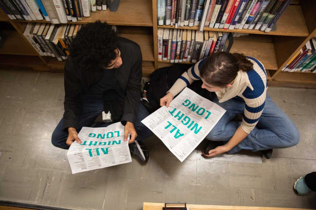 people reading at night at the library