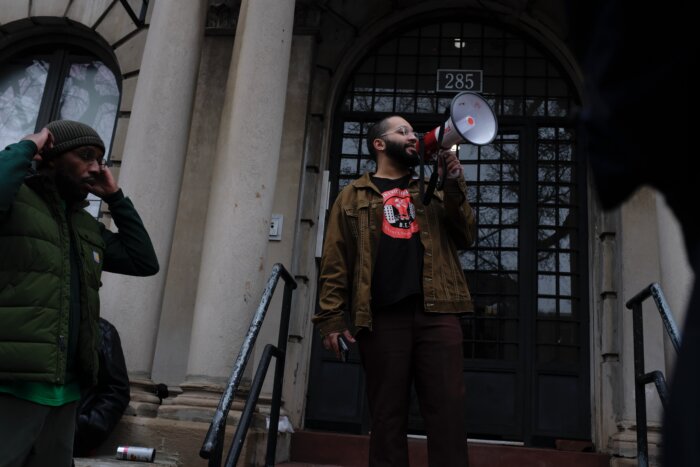 tenant with megaphone at crown heights rally 