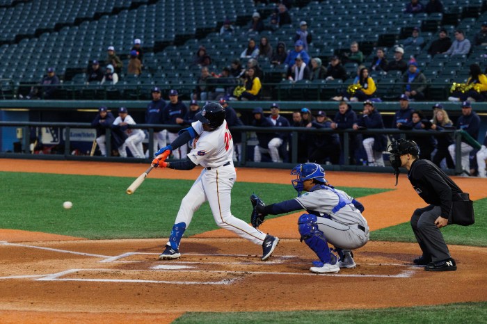 cyclones player hitting baseball