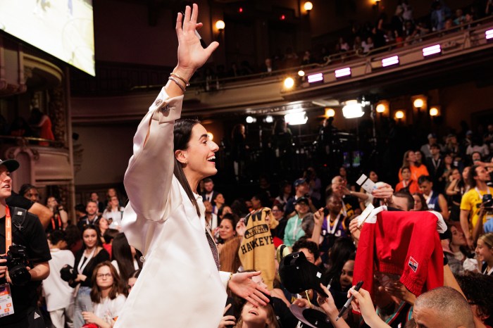 Caitlin Clark at the 2024 WNBA Draft. Fans crowded the star for photos and autographs.