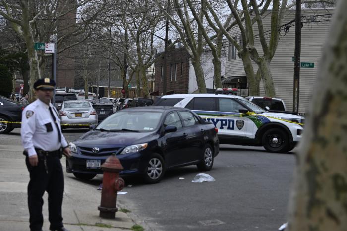 Cops stand around during the aftermath of the deadly collision.