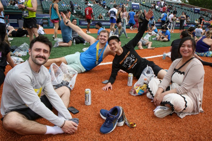 runners stretching after Brooklyn Half Marathon