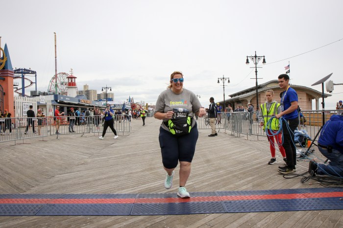 jennifer ducharme at finish line for Brooklyn Half Marathon