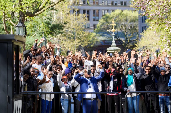 migrants outside city hall