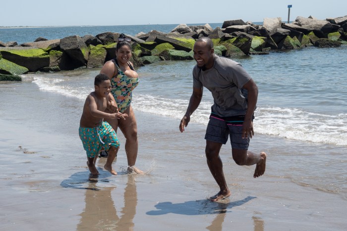 people in ocean at coney island
