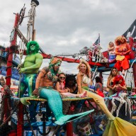 people pose at 2022 coney island mermaid parade