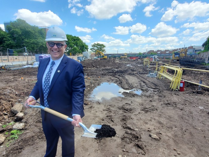 justin brannan with shovel at john dewey groundbreaking