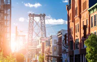 New York City sunlight shining on the Williamsburg Bridge in Brooklyn NYC