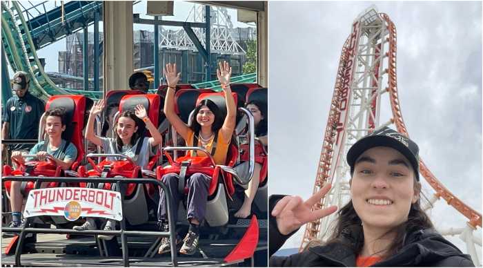 teen poses with thunderbolt coaster coney island