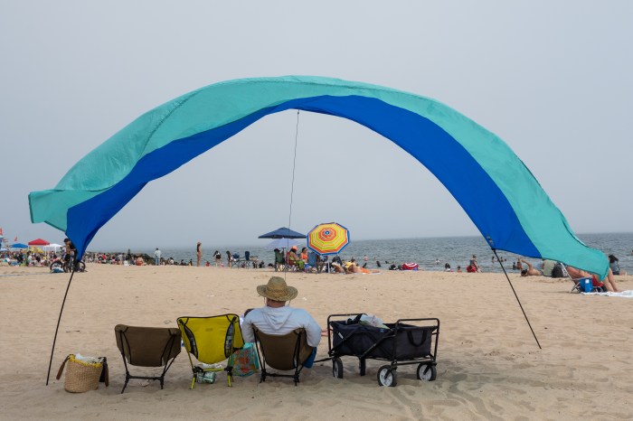 man chilling at Manhattan Beach