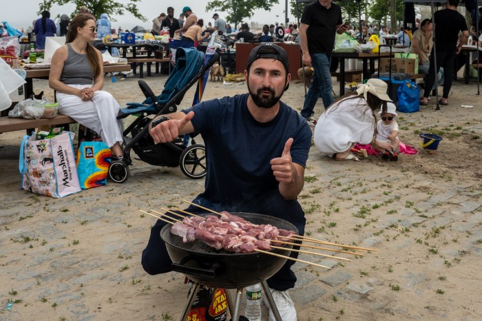 man grilling at manhattan beach
