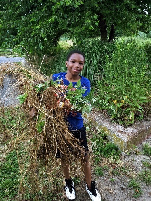 You're never too young to make an impact. One young volunteer was spotted helping out.