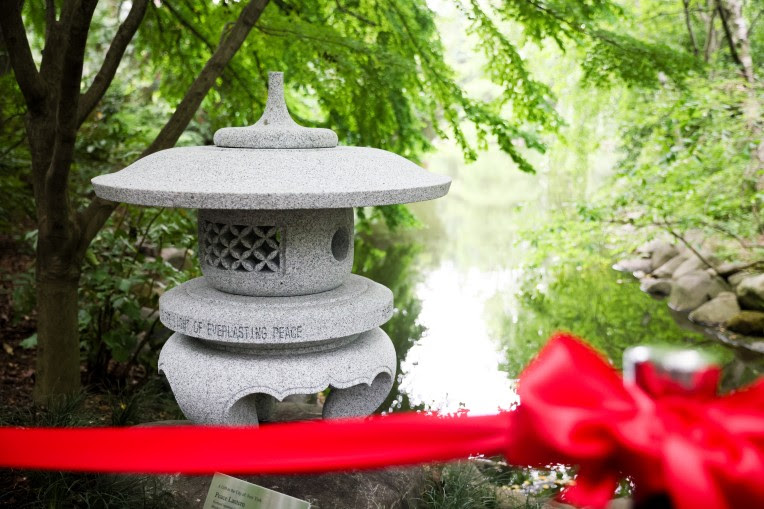 The peace lantern features a message of hope inscribed in capital letters: “CASTING THE LIGHT OF EVERLASTING PEACE.”