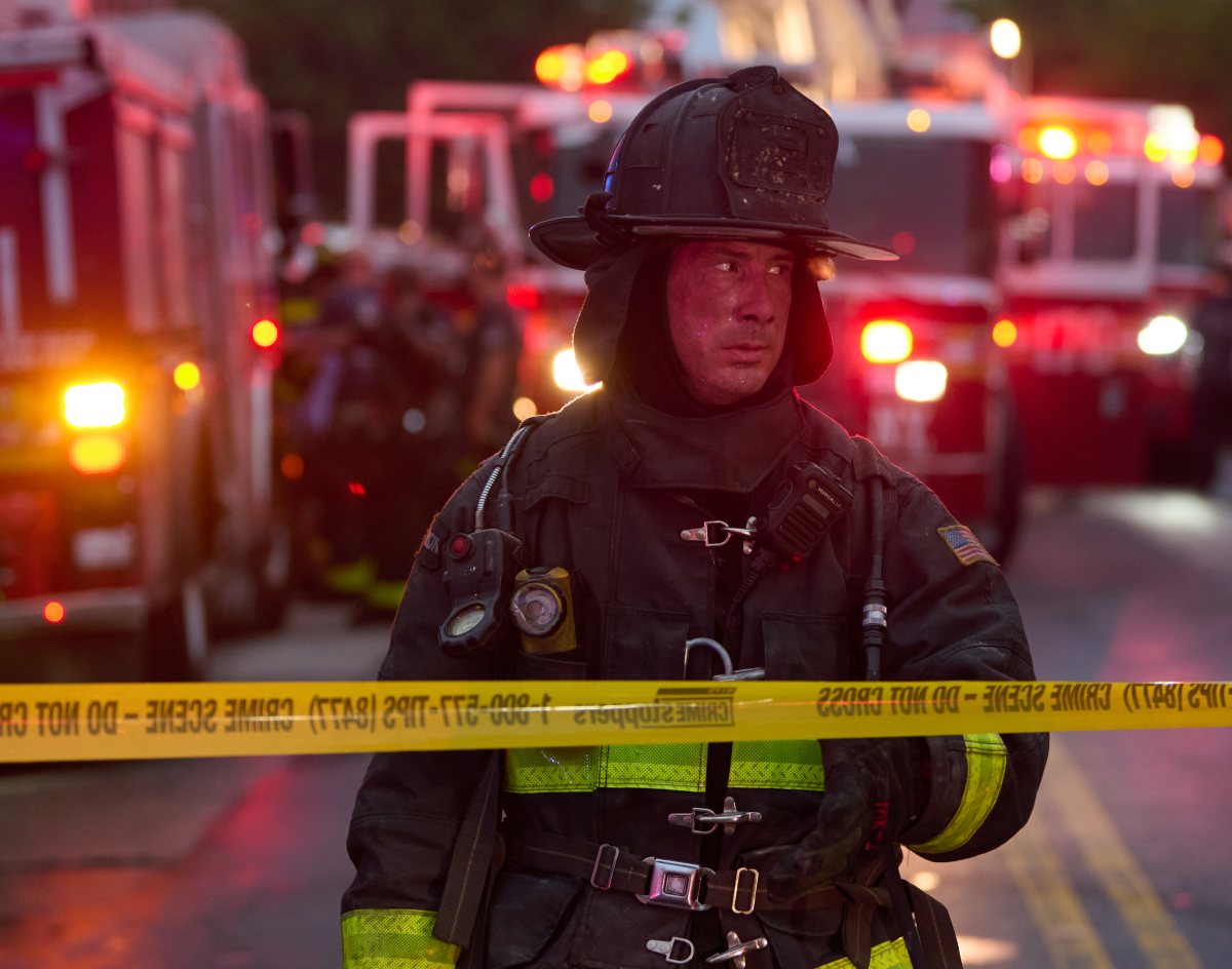 A firefighter  and FDNY EMS Paramedics work to resuscitation a cat found in the basement following a fire set by an  emotional disturbed person at 2204 Fulton Street on Thursday, August 8.. The EDP is in critical condition and a firefighter was left injured.