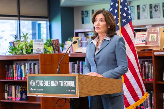 gov. kathy hochul at podium in school after-school funding
