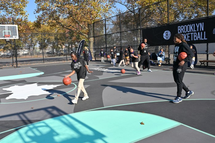kids playing on new basketball courts in East New York