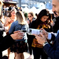 people pouring wine at food network new york city wine and food festival