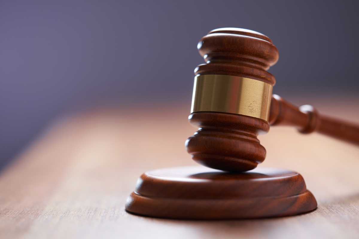 Selective focus on gavel hammer on wooden table top with copy space,Malaysia