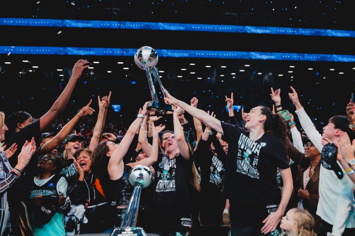 liberty with wnba championship trophy