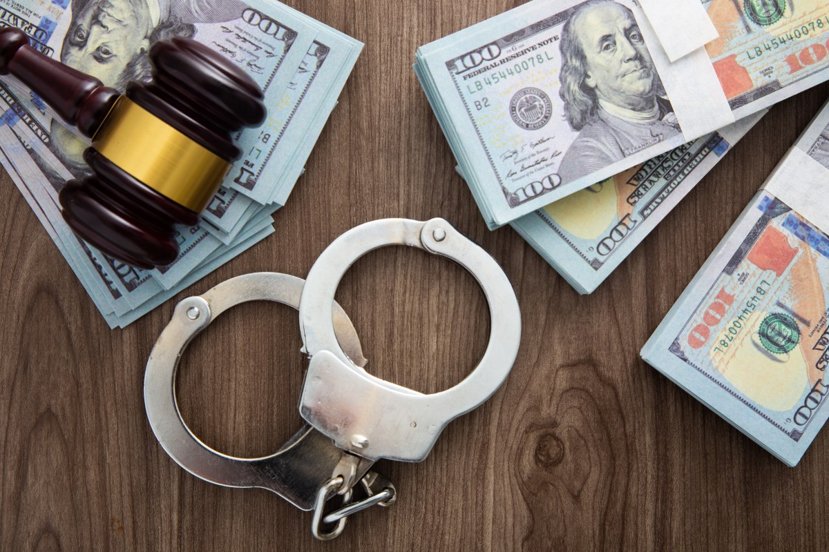 money-and-handcuffs-concept-for-corruption-fraud-2023-11-27-05-16-01-utc