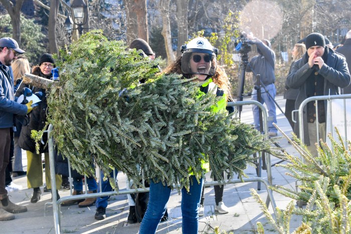 mulchfest 2024 woman with christmas tree