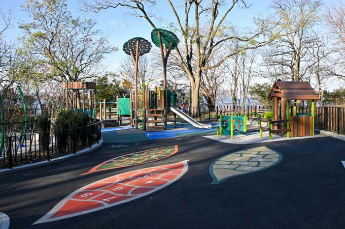 The renovated playground now offers new play equipment suitable for children of all ages and abilities, including a toddler playhouse, two swing sets, and painted games.