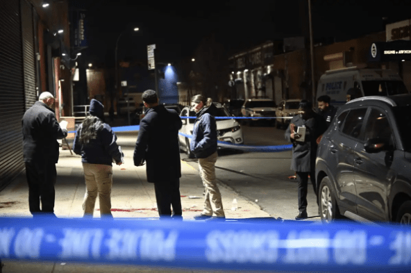 Detectives investigating the blood-soaked scene in Gowanus on Feb. 26, 2022.