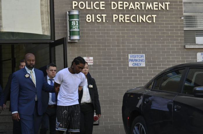 Brian Dowling pictured being escorted by detectives from the 81st Precinct in Bed-Stuy on Oct. 5, 2023.