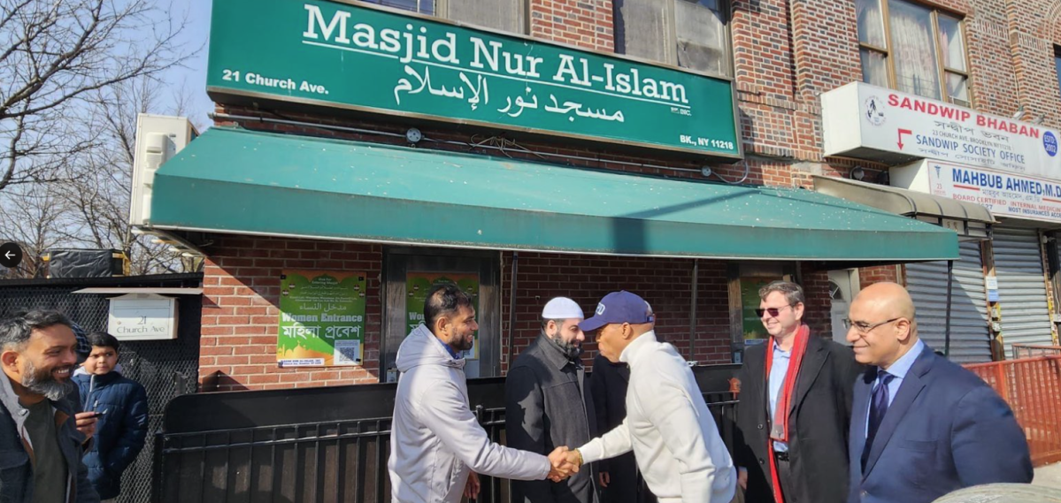 adams with mosque member in kensington