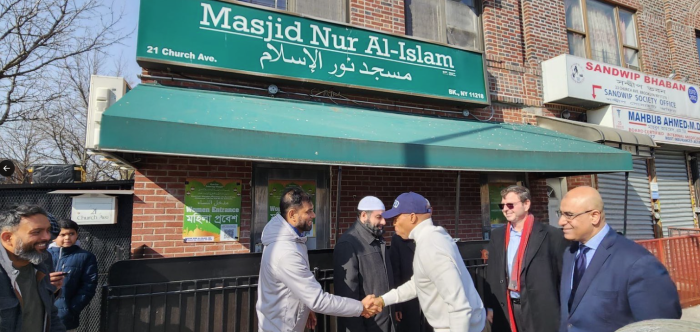 adams with mosque member in kensington