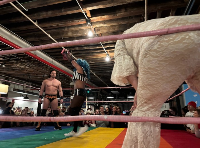 competitors in drag wresting ring