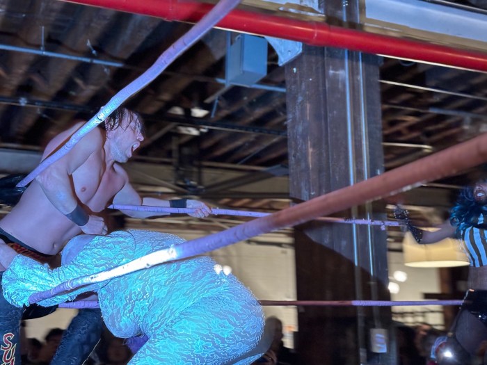 drag wrestlers in the ring