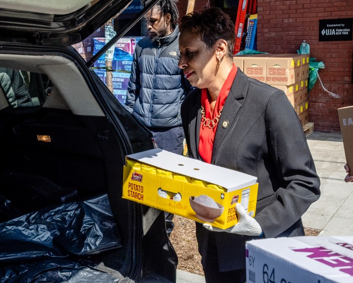 adrienne adams loading food for distribution