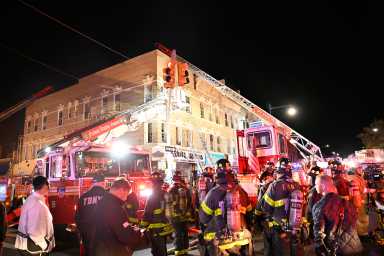 Over a hundred seventy five firefighters responded to a three alarm fire which heavily damaged a shoe store and apartments above, displacing 12 residents.