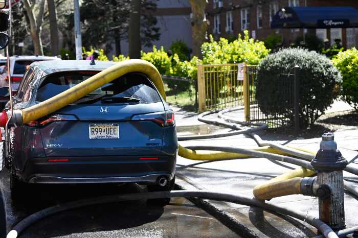 car parked in front oh hydrant