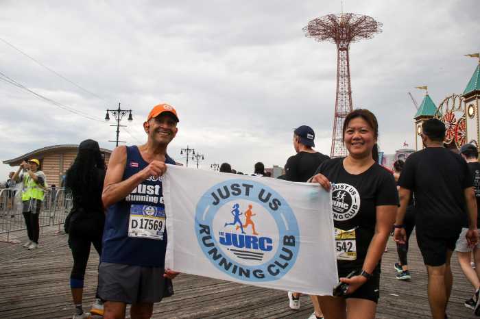 mina verzosa holding flag after brooklyn half