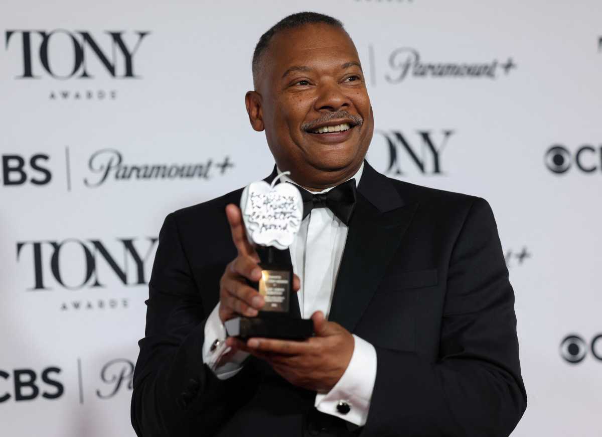 bed-stuy teacher posing with tony award