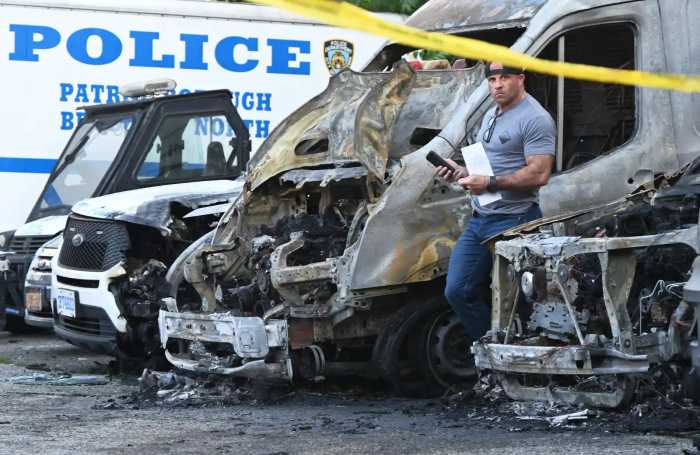 police officer in parking lot after fire