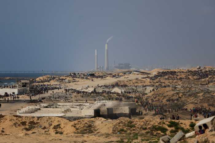 people waiting for aid in gaza