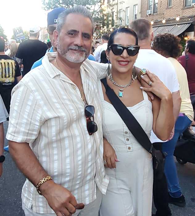 couple pose in the street at summer stroll 