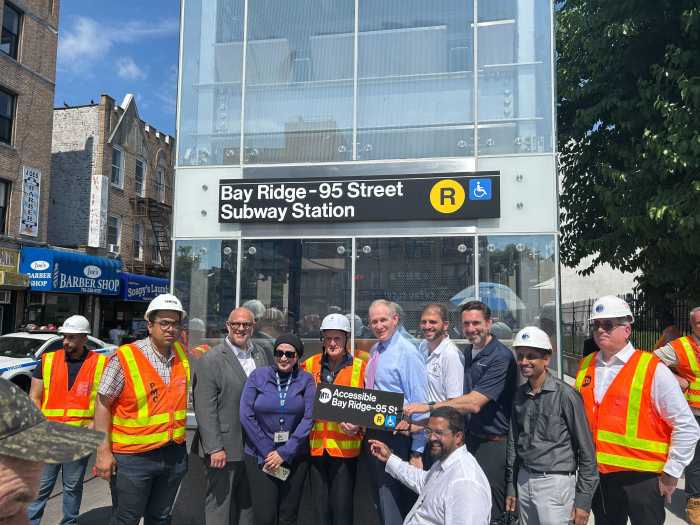 people celebrating elevators at bay ridge-95th street station