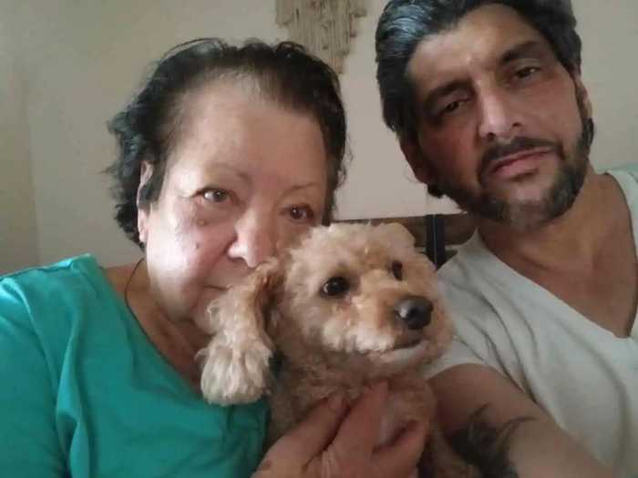 selfie of mother and son facing homelessness due to voucher issues