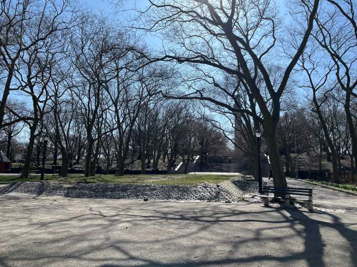 photo of fort greene park concrete plaza with trees on edges and stairs at far end