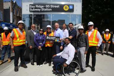 people at opening of elevators at bay ridge-95th street station