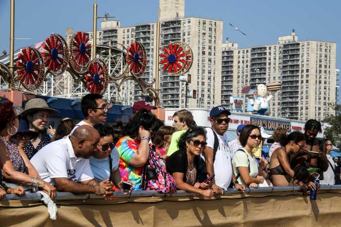 people watching sand sculpting contest