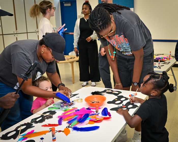 jonquel jones with kids crafting at library