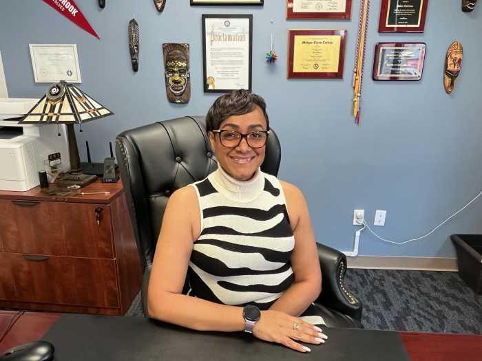ceo of mental health org sitting at desk