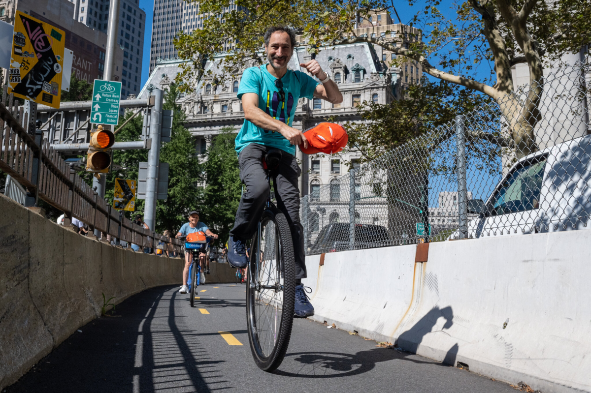 man riding in unicycle festival