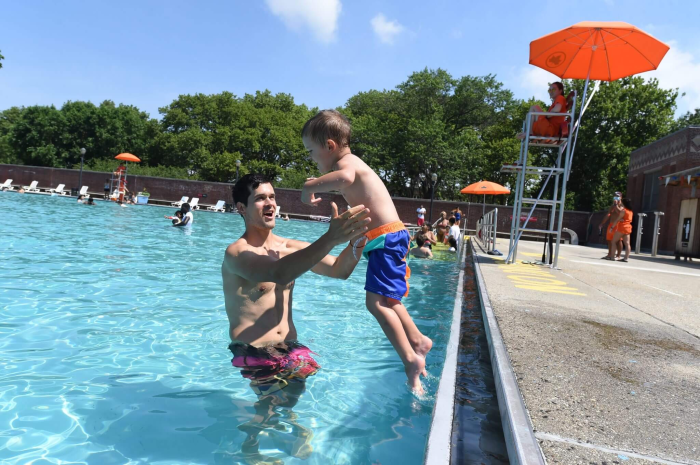 child with parent at public pool brooklyn public library