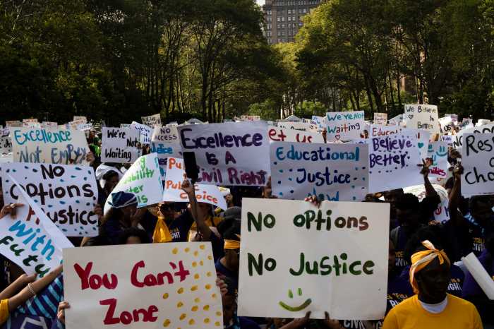 signs at charter school rally